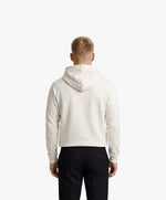 Vue de dos d’un homme portant un hoodie écru Salut Fred avec motif Quai Branly de la collection Rues de France