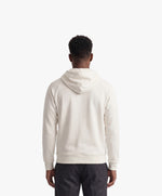Vue de dos d’un homme portant un hoodie écru Salut Fred avec motif Rue de la Paix de la collection Rues de France