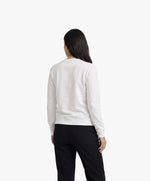 Vue de dos d’une femme portant un sweatshirt blanc Salut Fred de la collection Rues de France