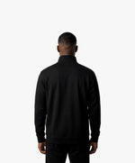 Vue de dos d’un homme portant le sweatshirt à col zippé 1/4 noir SF Monogramme Salut Fred