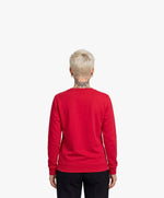 Vue de dos d’une femme portant un sweatshirt rouge Salut Fred de la collection « This is not woke. You are just a dick. »