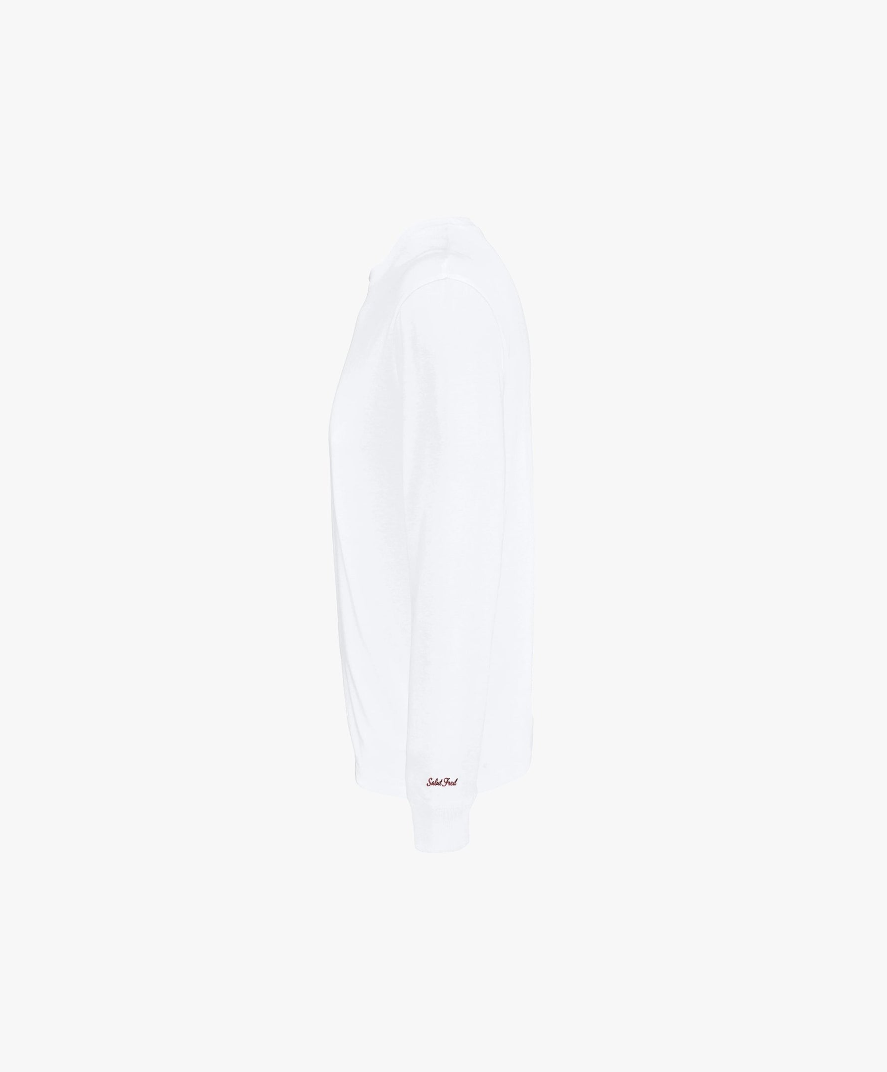 Vue côté gauche du t-shirt à manches longues blanc Salut Fred avec broderie rouge sur le poignet gauche.